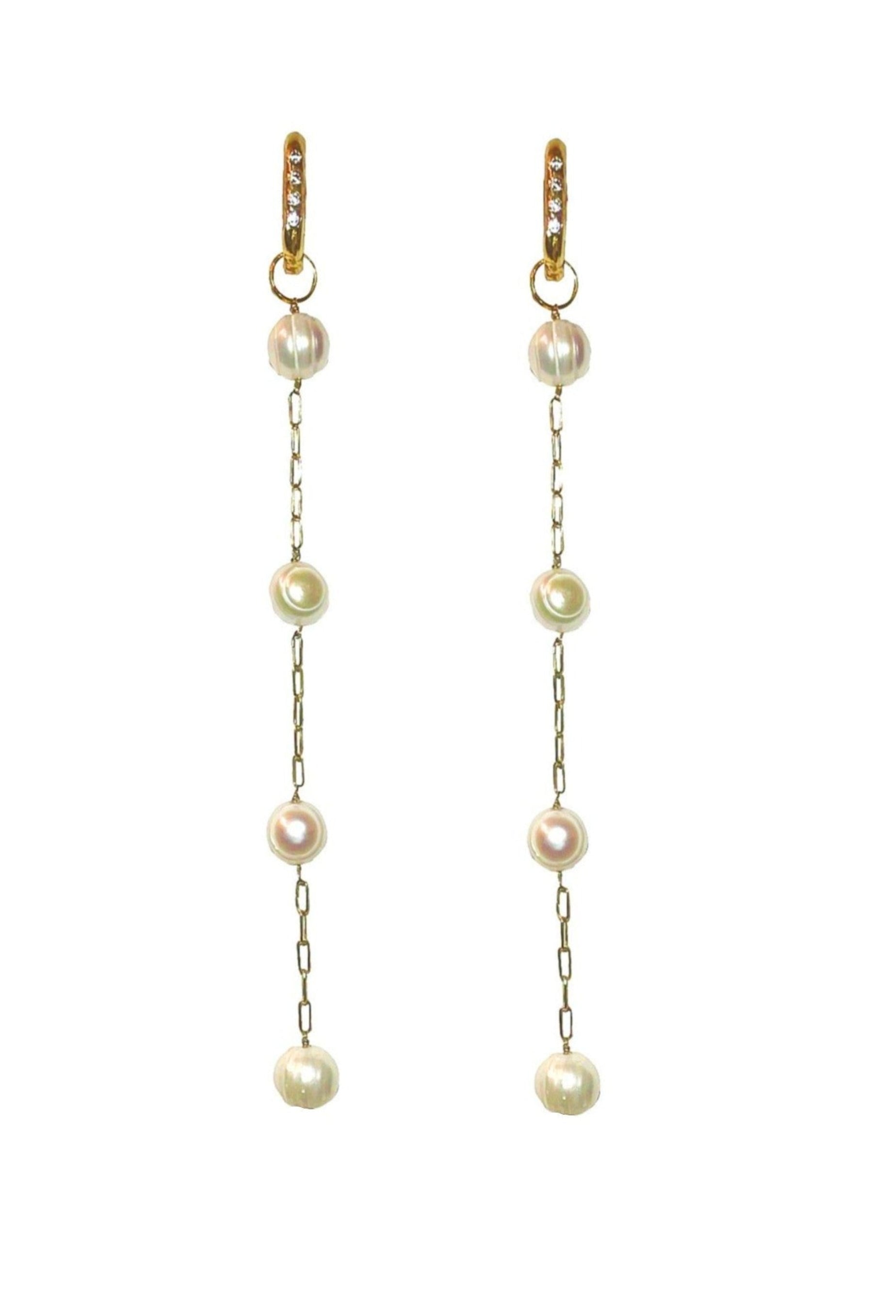 A pair of chandelier earrings featuring freshwater pearls and white topaz stones, suspended from 14k gold plated cable chains.