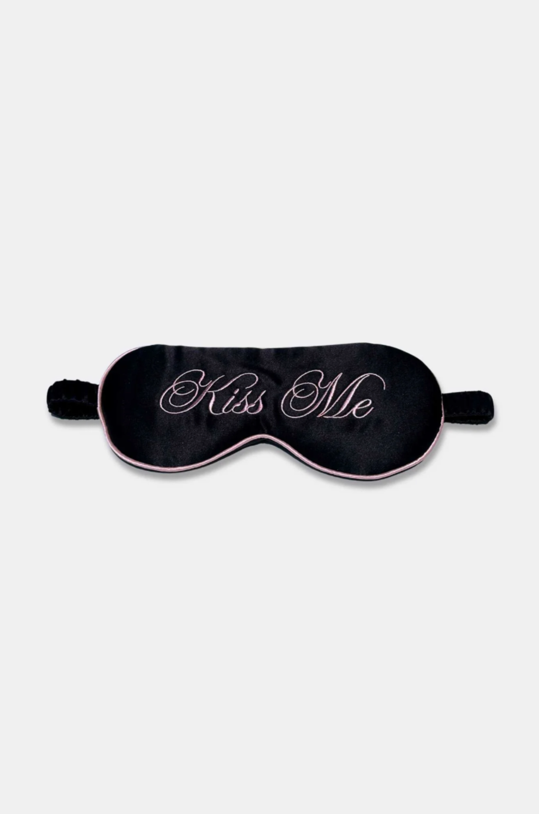 Black sleep mask with &#39;Kiss Me&#39; text on a white background